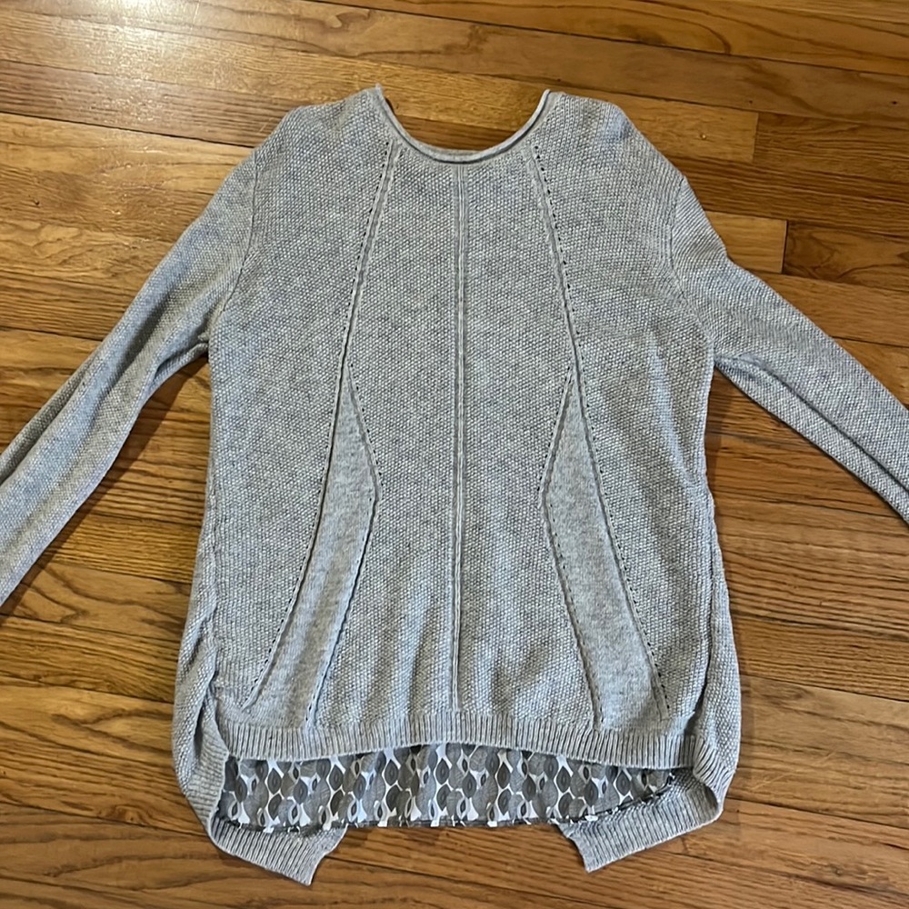 Soft long sleeve split back sweater long in length!